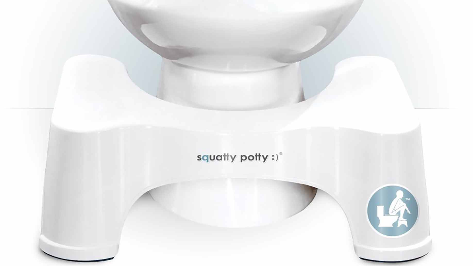 squatty potty demonstration under the toilet white