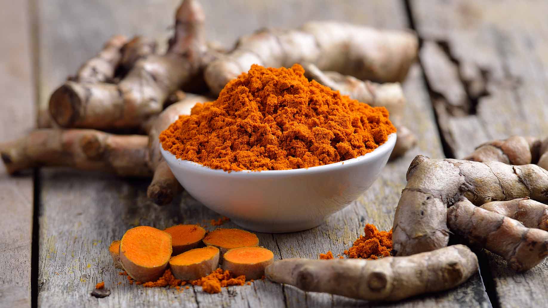 turmeric herb fresh roots orange powder